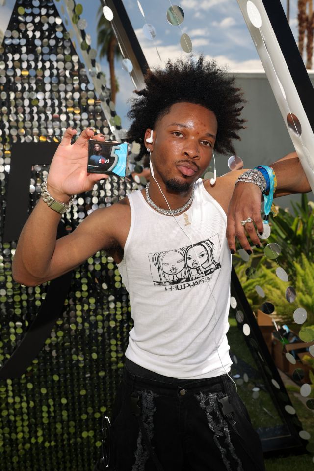d4vd holding a pack of 5 Gum at the Interscope and Capitol Records Coachella Party 2025.