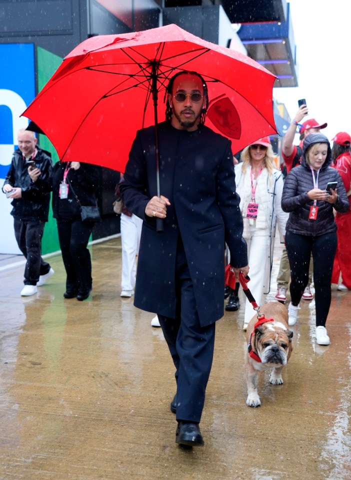 Ferrari driver Lewis Hamilton with his dog Roscoe ahead of the British Grand Prix at Silverstone Circuit, Northamptonshire. Picture date: Sunday July 6, 2025. PA Photo. Photo credit should read: Andrew Matthews/PA Wire. RESTRICTIONS: Use subject to restrictions. Editorial use only, no commercial use without prior consent from rights holder.