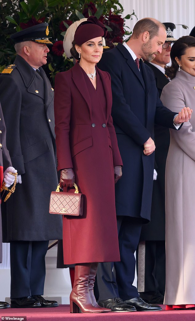 In December 2024, Kate greeted the Emir of Qatar during his UK state visit in a maroon Alexander McQueen coat, paying subtle tribute to Qatar's national colours