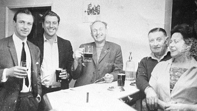 London gangster Charlie Richardson (far left) drinking a pint in the bar at the White Horse in the 1960s