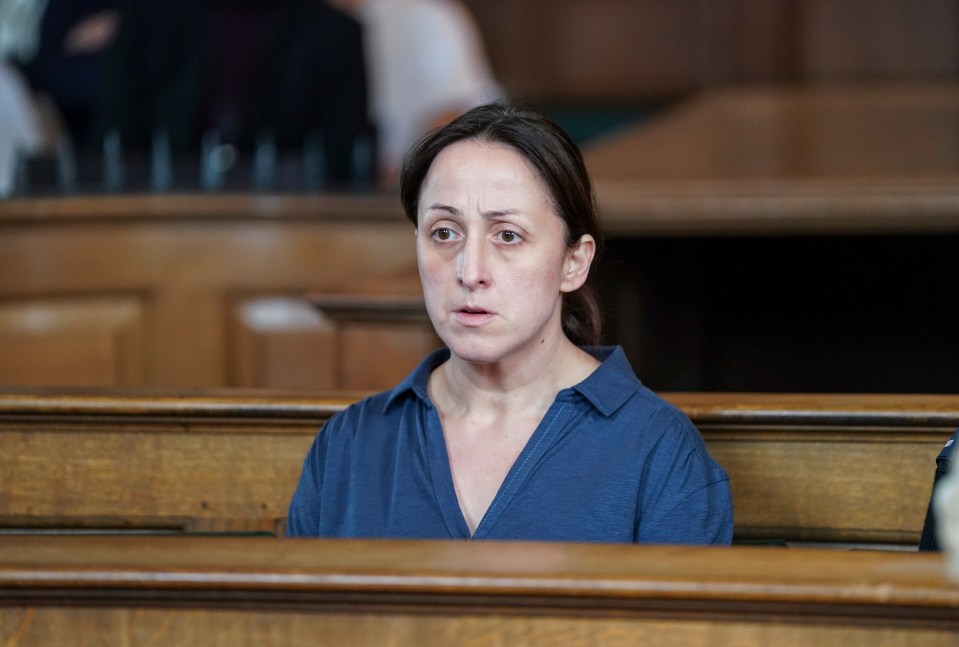Sonia Fowler from EastEnders, looking concerned, in a wooden pew.