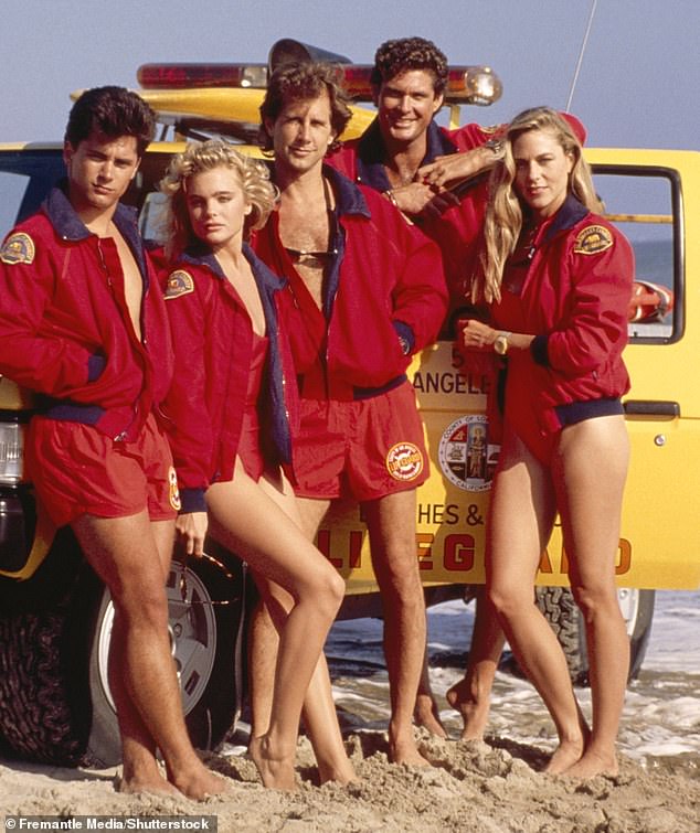 (L-R) Baywatch stars Billy Warlock, Erika Eleniak, Parker Stevenson, David Hasselhoff and Shawn Weatherly on the beach at the height of the show's popularity in the early 1990s