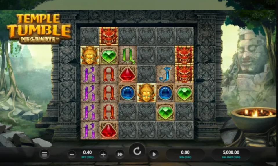 Screenshot of the "Temple Tumble Megaways" slot machine game interface showing a stone grid with various symbols like gems, card letters, Buddha heads, and demon masks, set against an ancient temple background.