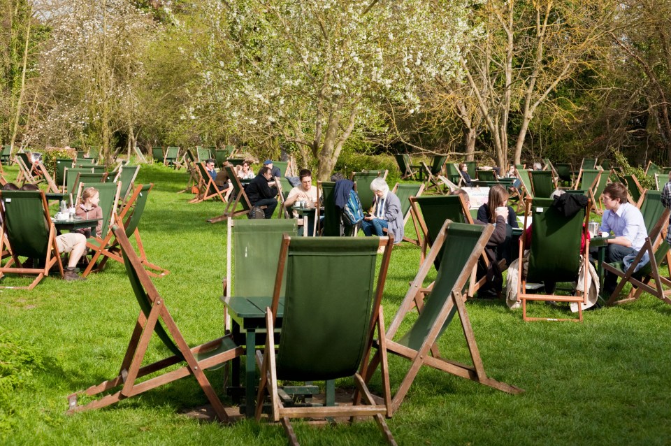 People enjoying tea and picnics in the Orchard tea garden in Grantchester.