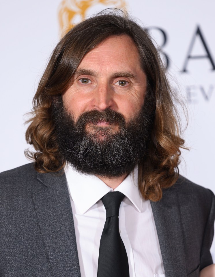 Joe Wilkinson posing in the Winners' Room at the BAFTA Television Awards.