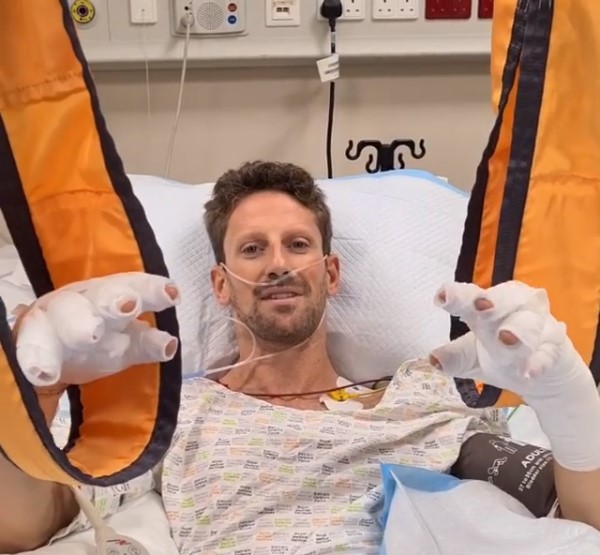 Romain Grosjean in a hospital bed with bandaged hands after the Bahrain GP crash.