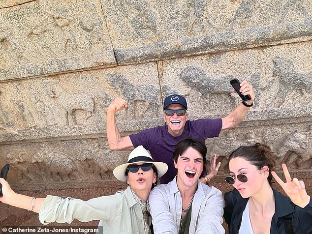 The loved up couple, who are parents to Dylan, 25, and Carys, 22, (pictured with their parents) have proven their doubters wrong with Catherine describing the marriage as full of 'love'