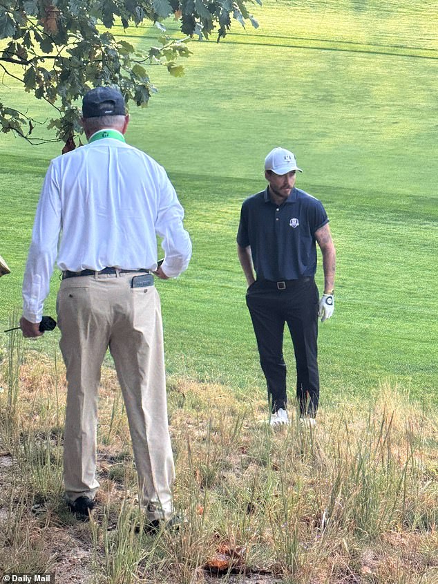 With help from volunteers at the golf tournament, Beckham continued his search for the ball
