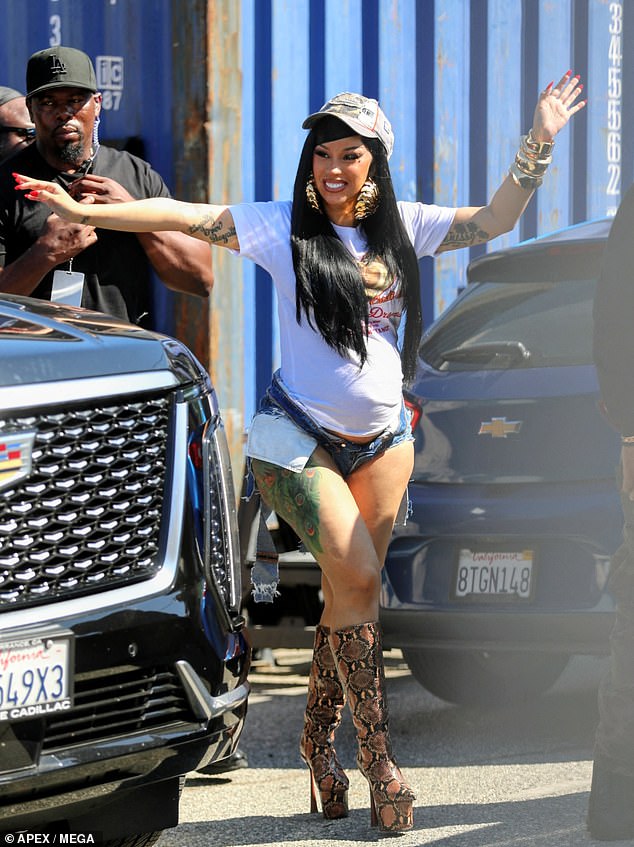 She wore a T-shirt with a meme of her face on it and snakeskin-patterned, platform boots with sky-high heels