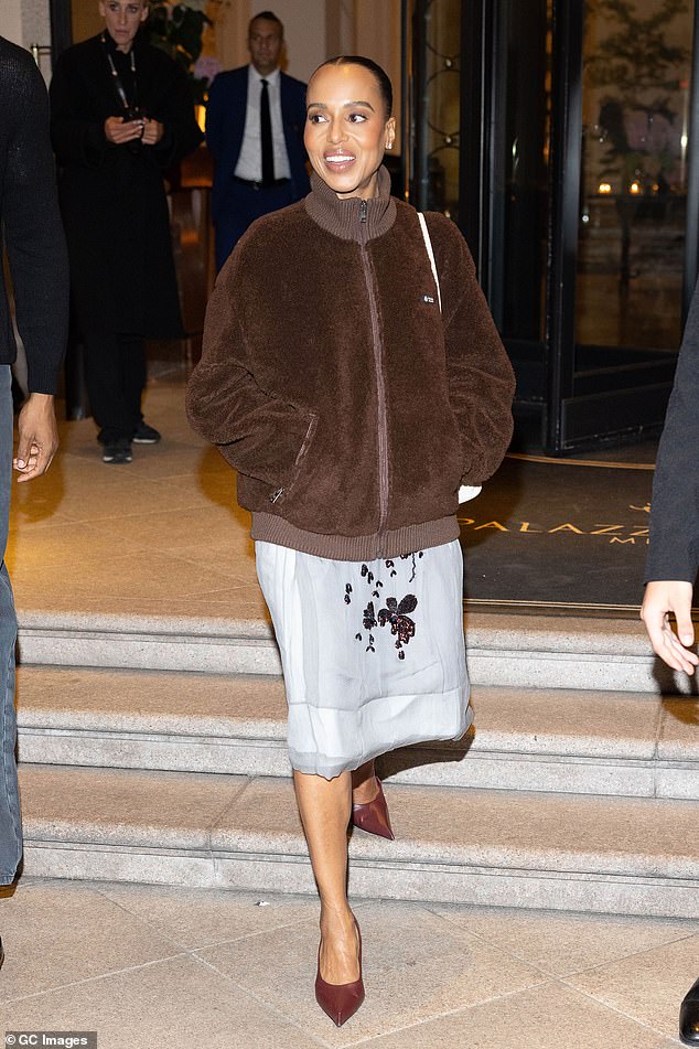 Kerry Washington looked stylish in a brown coat, white midi skirt and pointed heels