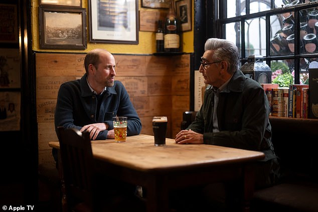 They are shown sitting down for a pint in the corner of a pub - with Levy opting for a Guinness