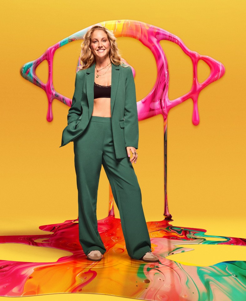 Ali from Big Brother TV show standing in spilled paint.