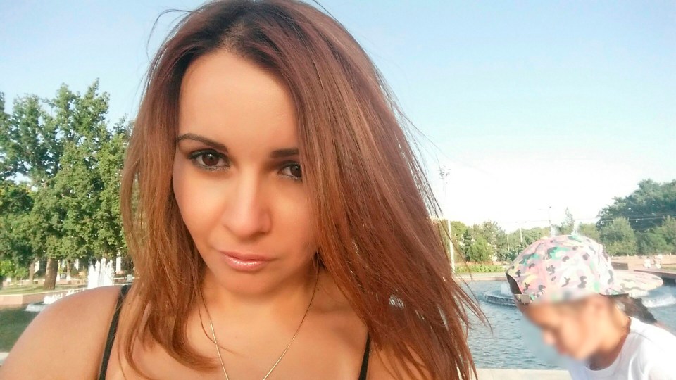 Linariya Muzipova posing for a selfie outdoors.