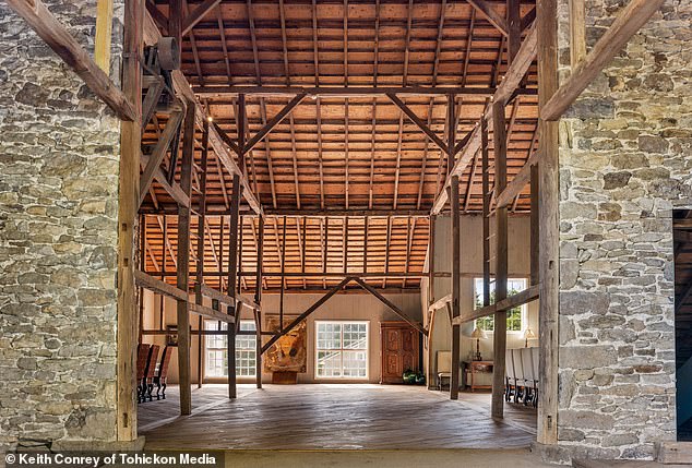 Beyond horses, the property reflects its authentic farm lifestyle. In the barn, goats peek out from immaculate stalls, underscoring the blend of rustic authenticity and luxury