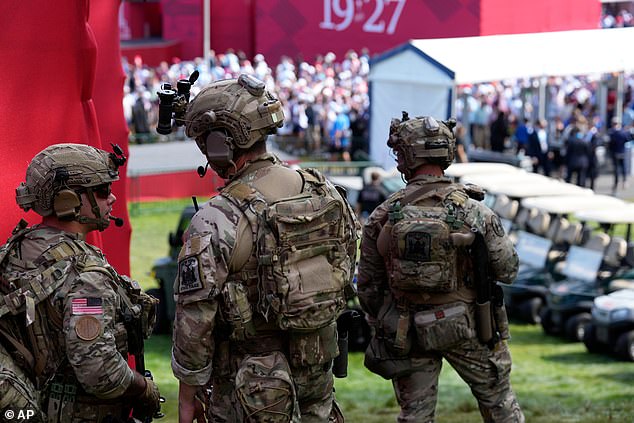 US snipers prepare to take their position at the top of the first tee grandstand
