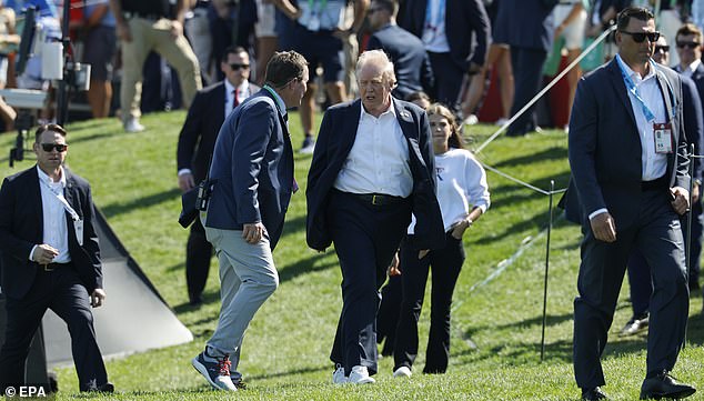 epa12408420 US President Donald Trump makes his way to the grand stand at the 2025 Ryder Cup golf tournament at the Bethpage Black Golf Course in Farmingdale, New York, USA, 26 September 2025. US President Donald Trump attended the afternoon session of the Ryder Cup.  EPA/ERIK S. LESSER