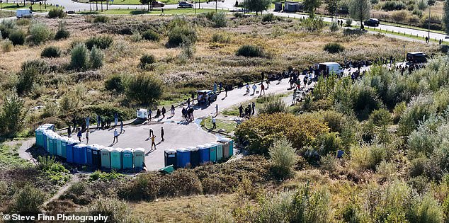 In the many years I have reported on the migration crisis sweeping Europe, I have never seen the ferry port so overwhelmed. Pictured: A new migrant camp in Calais, including toilets and showers