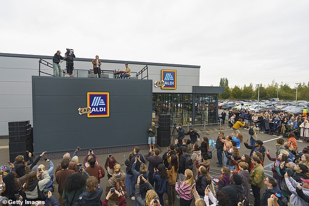 Overlooking the car park The Scottish hitmaker  jokingly apologised to customers for potentially disrupting their shopping and went on to praise the store's offer