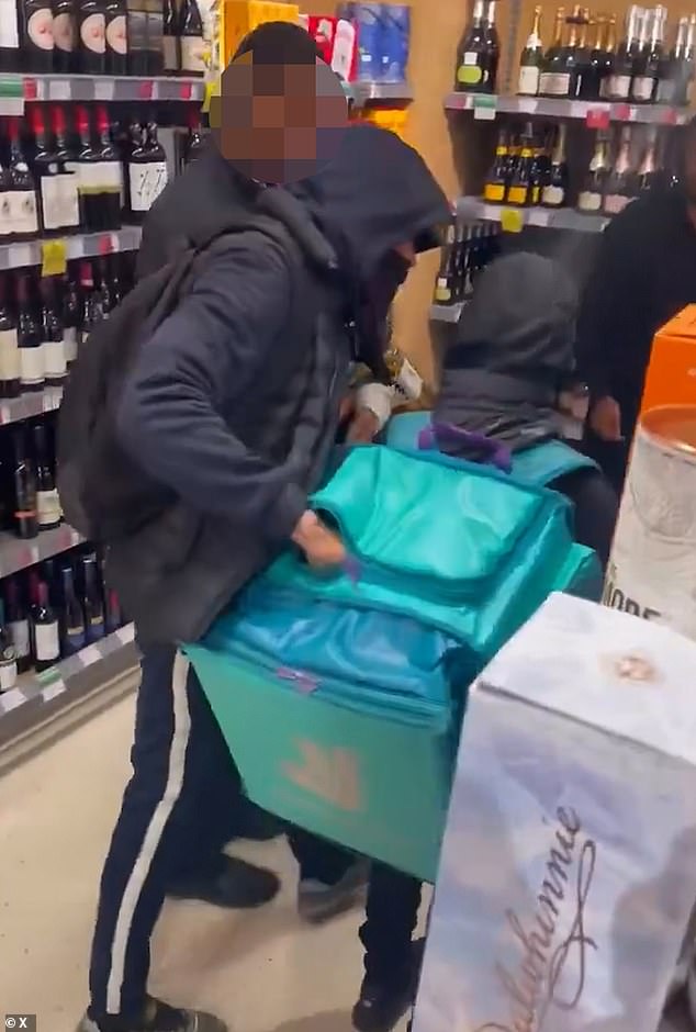 The video shows horrified shoppers and a security guard standing beside them simply watching at the Clerkenwell, London store
