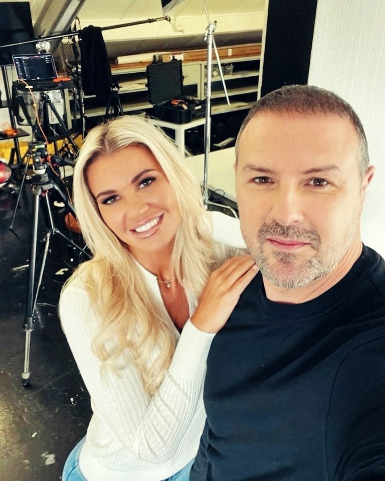 Paddy McGuinness and Christine McGuinness posing for a photo in a studio.
