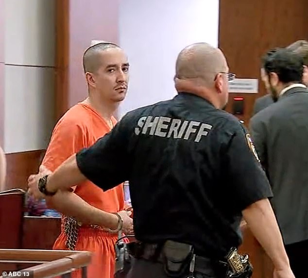 Anderson being escorted in 2023 after he allegedly gunned down his wife Victoria while their three-year-old son was present