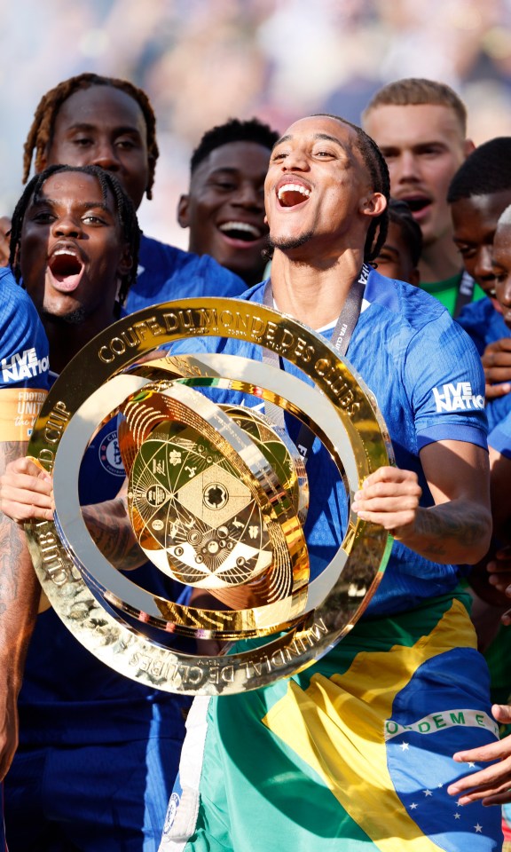 Joao Pedro and Chelsea teammates celebrate with the FIFA Club World Cup trophy.