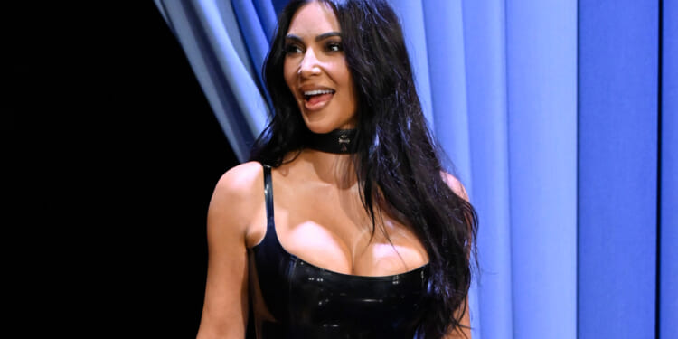 Kim Kardashian stuns in sexy black dress as she shows off her secret tattoo