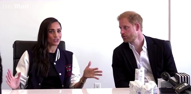 When Meghan interrupts Harry for the second time he 'appears to detach from the conversation'