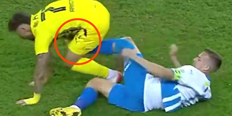 Shocking moment footballer kicks rival in privates then is immediately sent off
