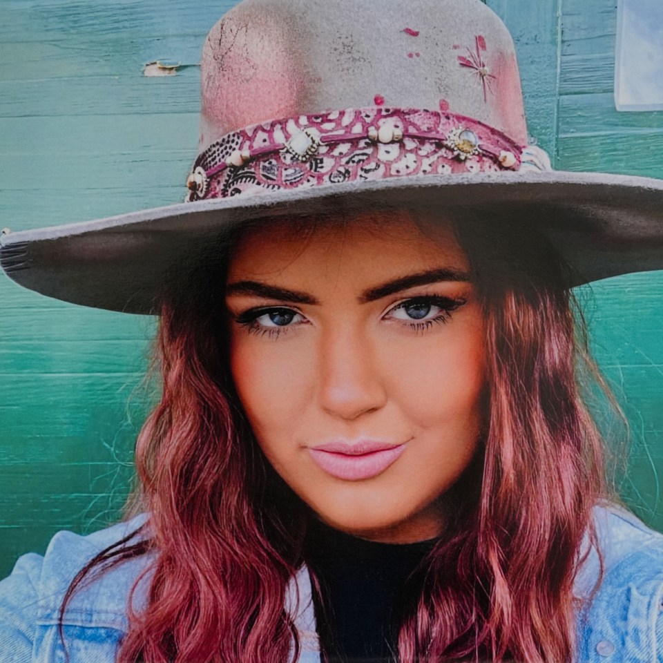 Hannah Byrne wearing a hat and jean jacket.