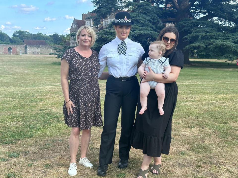 Hannah Byrne in police uniform with her mother Sarah and cousin Lauren holding her son Jenson.
