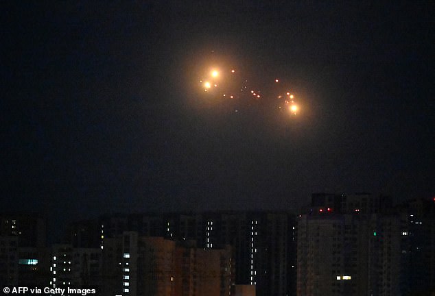 Almost half of those surveyed in a recent poll of the nation's population said they would not answer a call to arms in the event of war. Pictured: Ukrainian air defence fires at Russian drones above Kyiv during strikes on Ukraine on September 10, 2025