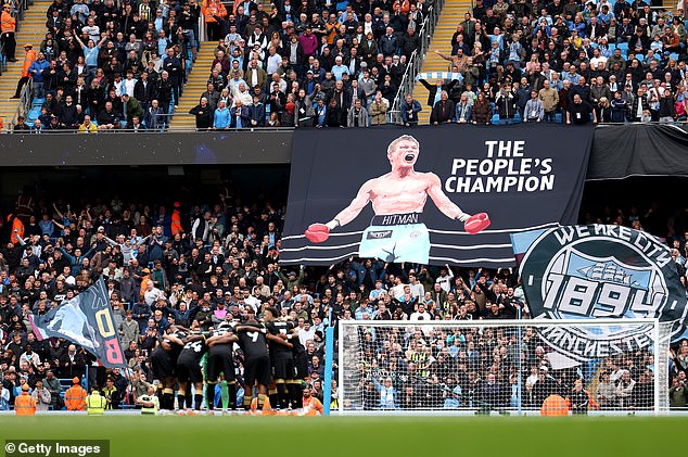 City unveiled a tifo featuring Hatton wearing City shorts and the words: 'The people's champion'