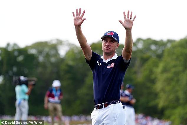 Justin Thomas pictured appealing for the crowds to cool down during his round on Saturday