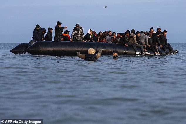 It comes just days after Sir Keir Starmer said Labour has 'shied away' from confronting 'people's concerns' around immigration and UK borders. Pictured: Migrants try to board a smuggler's boat to cross the Channel at Gravelines, France, on September 19, 2025