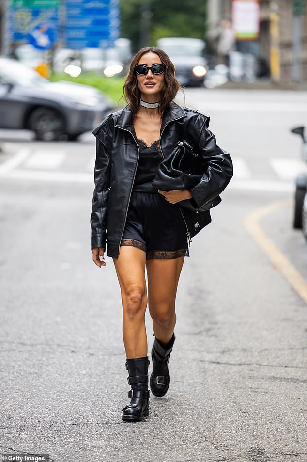 Tamara Kalinic stepped out in satin black shorts, which she paired with a matching vest and chunky black boots