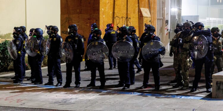 Trump orders deployment of troops to ‘war-ravaged’ liberal city to protect ICE facilities and authorises 'full force'