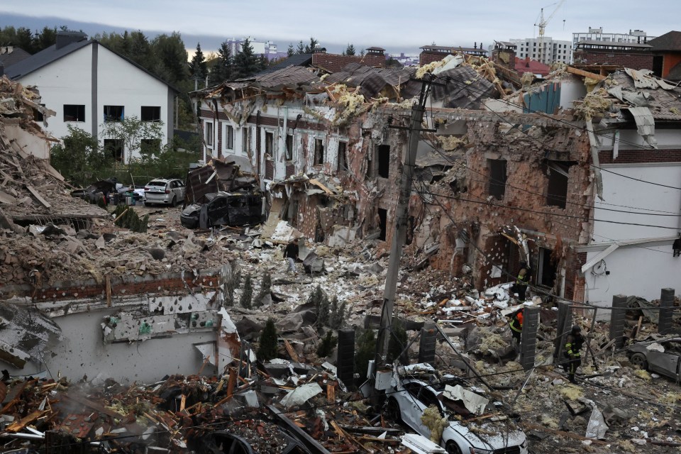 Emergency workers operate at a residential impact site after missile attacks in Kyiv, Ukraine.