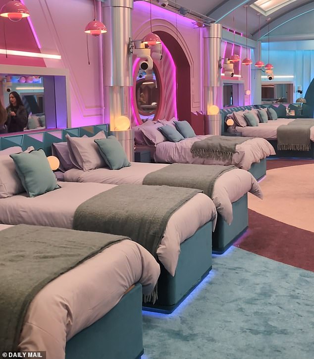 The bedroom, with hues of teal and pinks, has three double beds, meaning some housemates will be forced to get very cosy very quickly