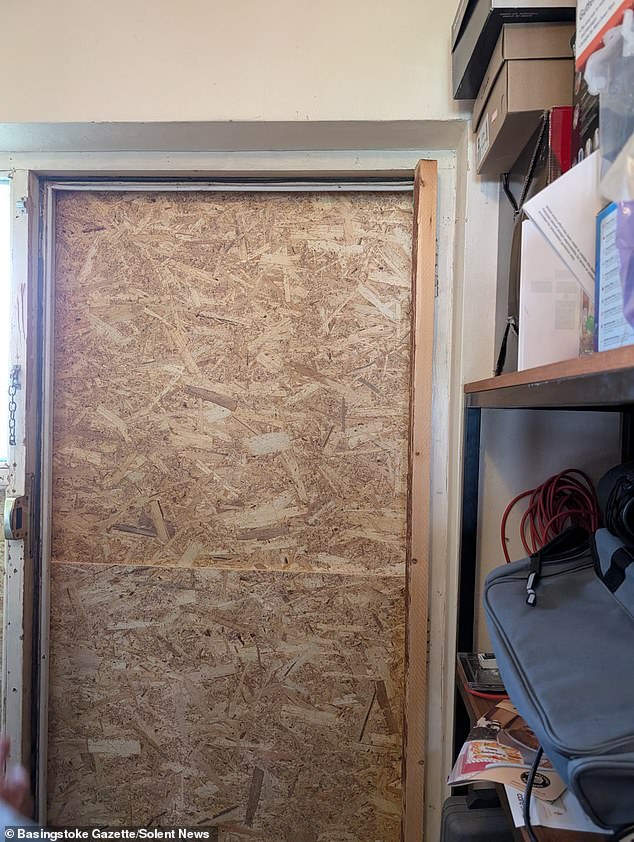 His door was broken despite the fire being confined to the nearby shop