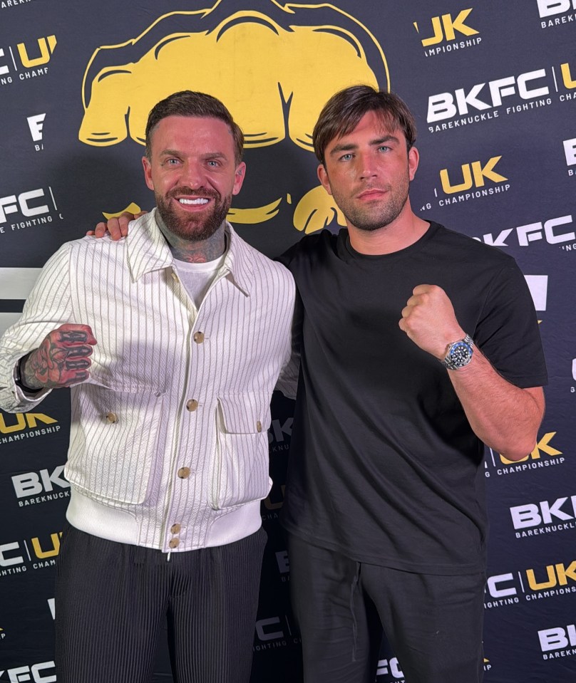 Jack Fincham with Aaron Chalmers against a black and yellow "BKFC Bareknuckle Fighting Championship" backdrop.