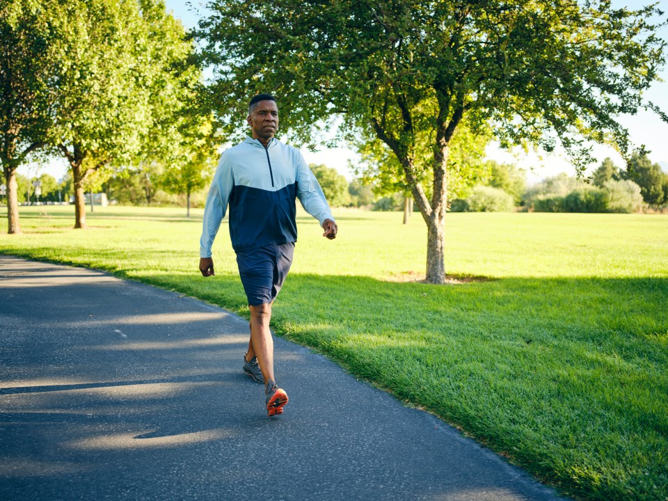 Mature Black man exercising in a park.