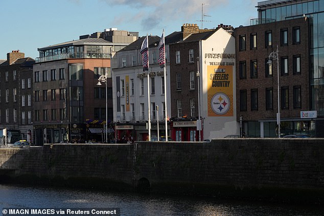 The NFL is taking over Dublin, Ireland, with the Steelers logo seen on the side of a building