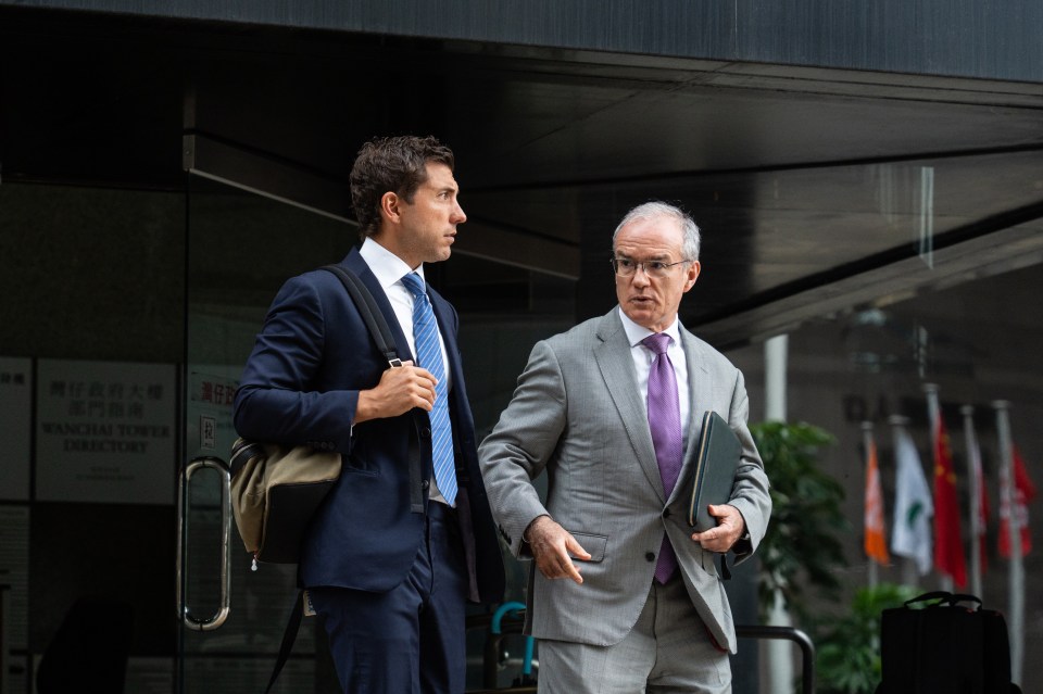Daniel La Rocca and Alan Linning leaving the District Court in Hong Kong.