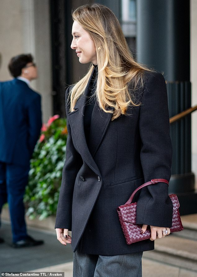 Eve, (pictured) who is the youngest of the late Steve and Laurene Powell Jobs's children, shone in glowy makeup as she strolled out of her hotel in the Italian fashion capital
