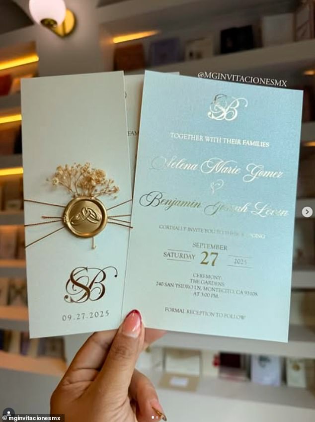 The white based invites featured beautiful gold lettering and wax details with some pretty white flowers attached to the front of each one