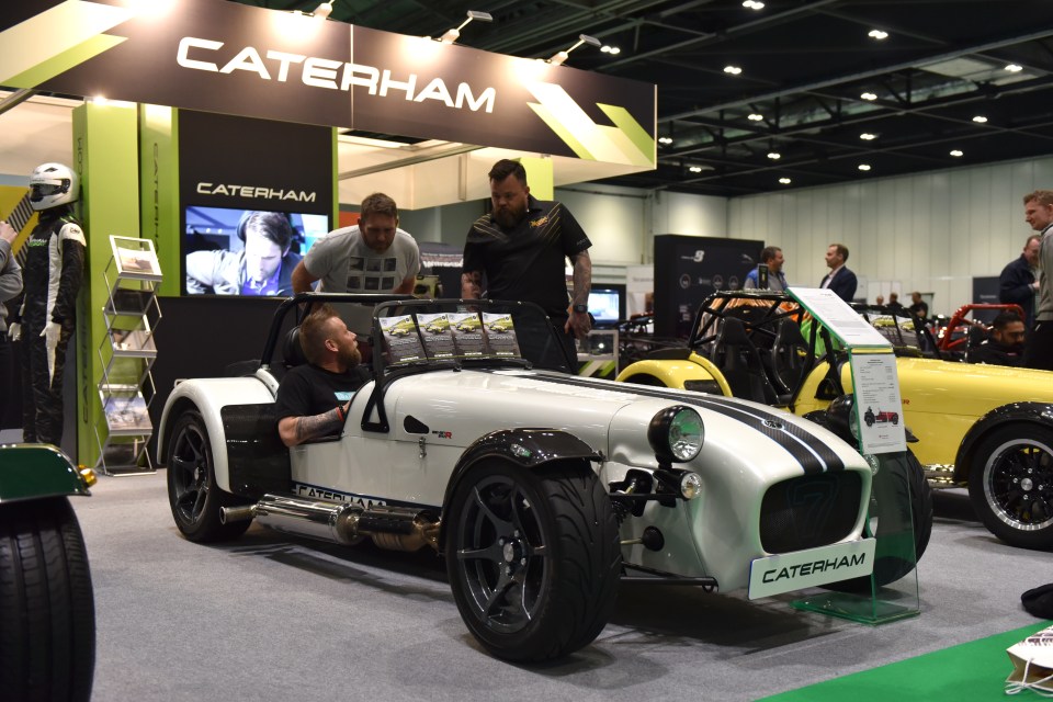 A Caterham Seven 310R is displayed at the London Motor and Tech Show.