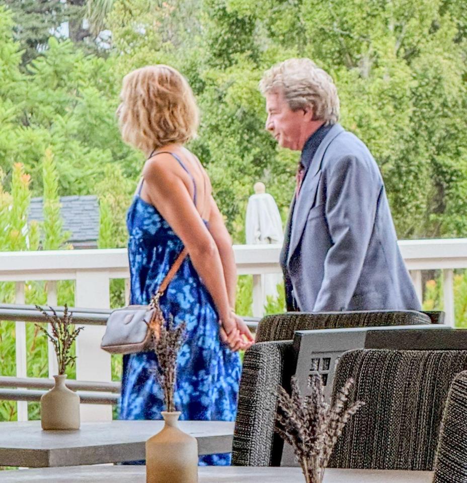 Comedian Martin Short and a woman standing on a veranda.