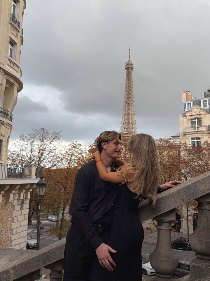 Jessie and Will from Love Island embracing in front of the Eiffel Tower.