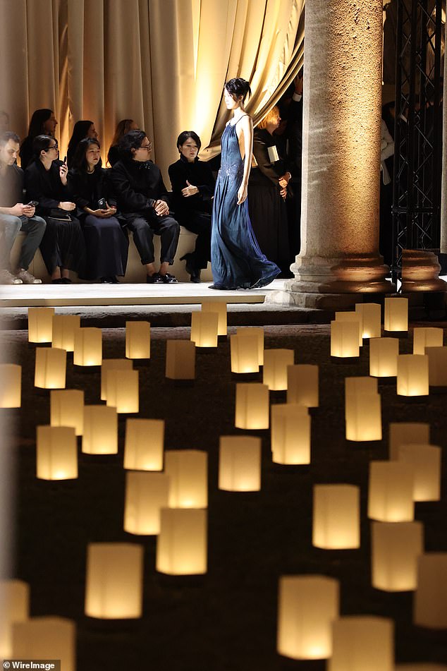 In celebration of his life, t he courtyard of the Pinacoteca di Brera Museum was lined with candles while the fashion house described their 'infinite sorrow' at his loss